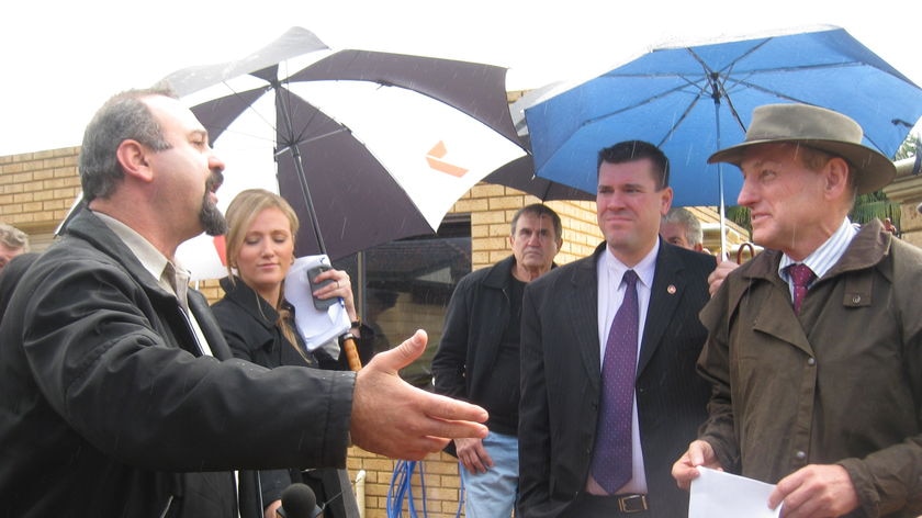 Spearwood resident John Cunai speaks to Water Minister Graham Jacobs.