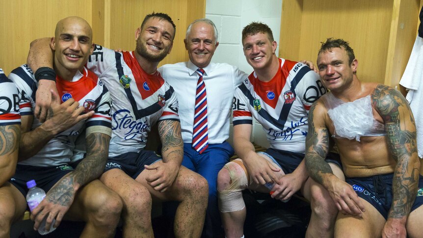 Sydney Roosters players share a photo with Prime Minister Malcom Turnbull
