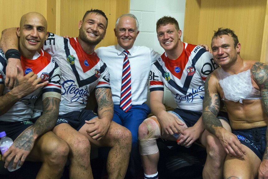 Sydney Roosters players share a photo with Prime Minister Malcom Turnbull