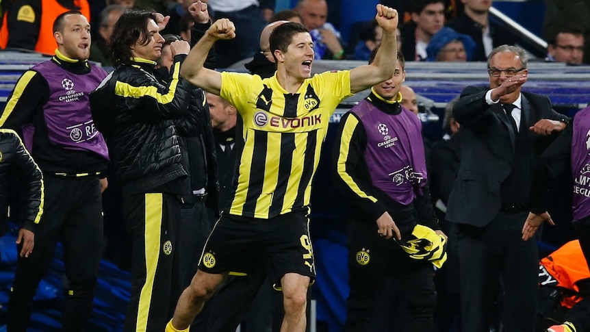 Dortmund's Robert Lewandowski celebrates a nervy 4-3 aggregate win after the final whistle.