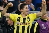 Dortmund's Robert Lewandowski celebrates a nervy 4-3 aggregate win after the final whistle.