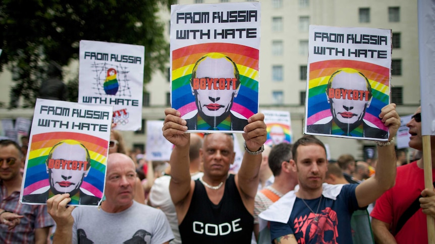 Protesters holding anti-Putin posters march past Downing Street in central London on August 10th, 2013.