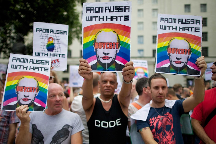 Protesters holding anti-Putin posters march past Downing Street in central London on August 10th, 2013.