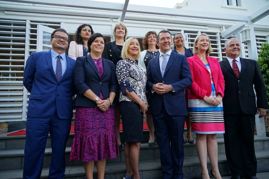 The new NT Labor cabinet stand together in front of Government House.