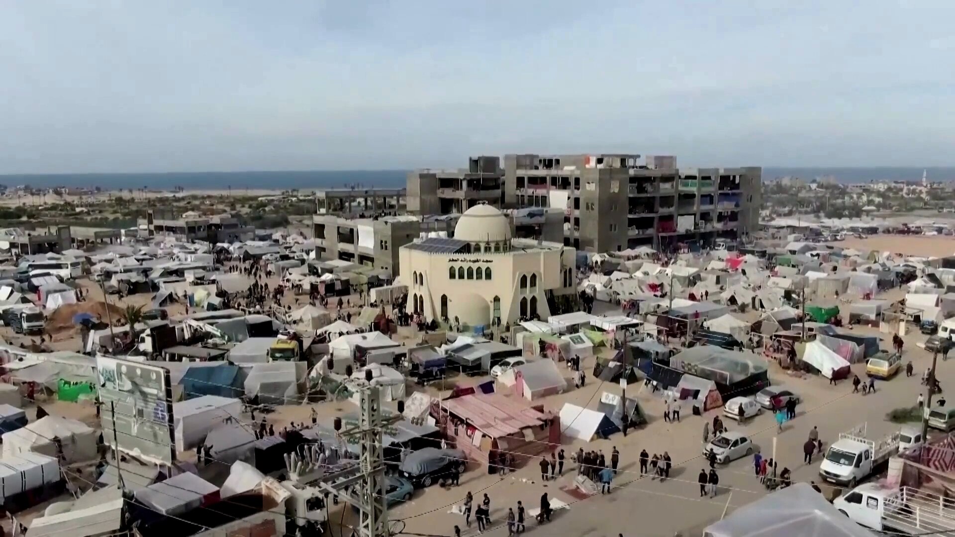 Refugee tents crowd around city streets 