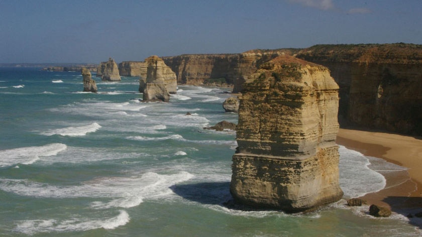 The twelve apostles, large pieces of rock jutting out from blue ocean.