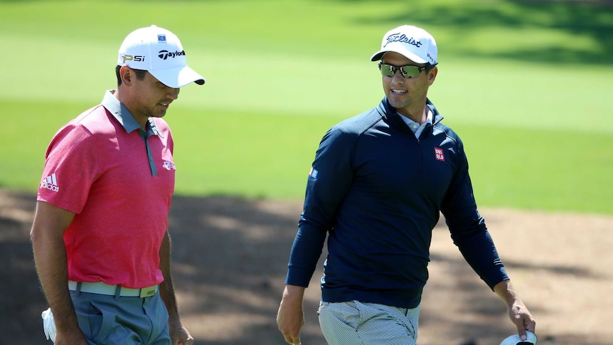 Adam Scott and Jason Day during a pre-Masters practice round at Augusta