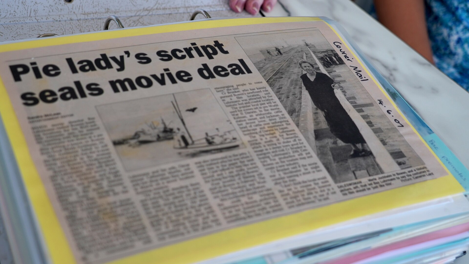 A newspaper clipping with the headline 'Pie lady's script seals movie deal'