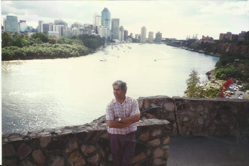 Mohammad Sarwari standing in front of the Brisbane River in 1996