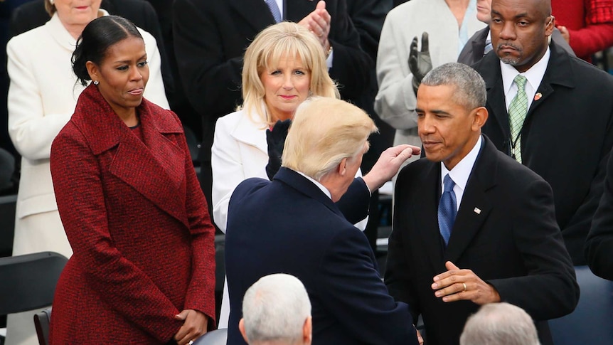 Hillary Clinton watches the swearing-in ceremony for Donald Trump at the US Capitol.