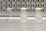 A row of clear medical vials.