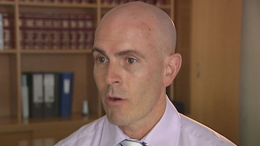 TV still of Jason Woodforth, LNP Member for Nudgee, speaking to media in December 2012