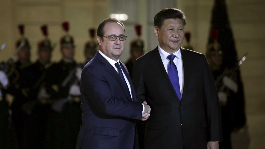 French president Francois Hollande welcomes his Chinese counterpart Xi Jinping