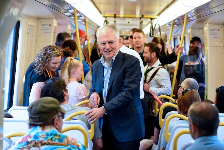 Australian Prime Minister Malcolm Turnbull meets passengers