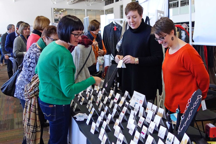 Business co-owners Jade Lawrie and Natalie Bruno sell jewellery at the Handmade Market
