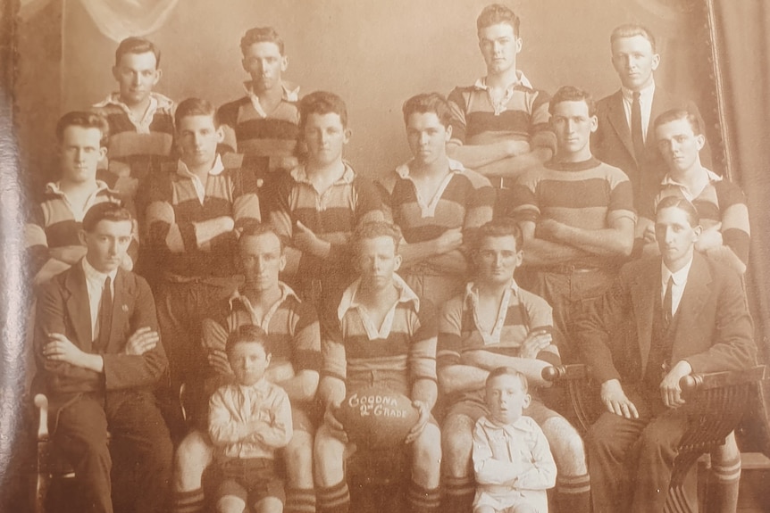 A black and white group photo of rugby team.