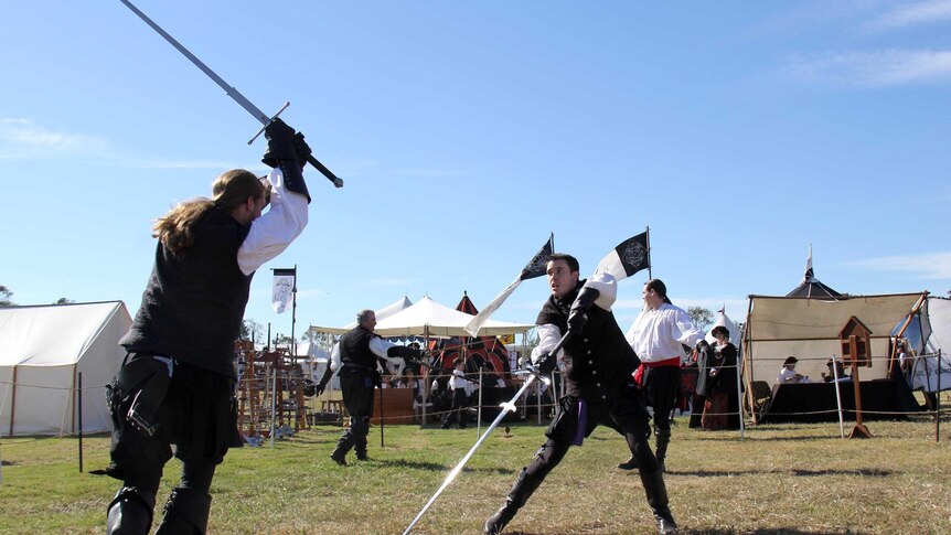 Renaissance period duellers face each other in the fencing circle during the History Alive event.