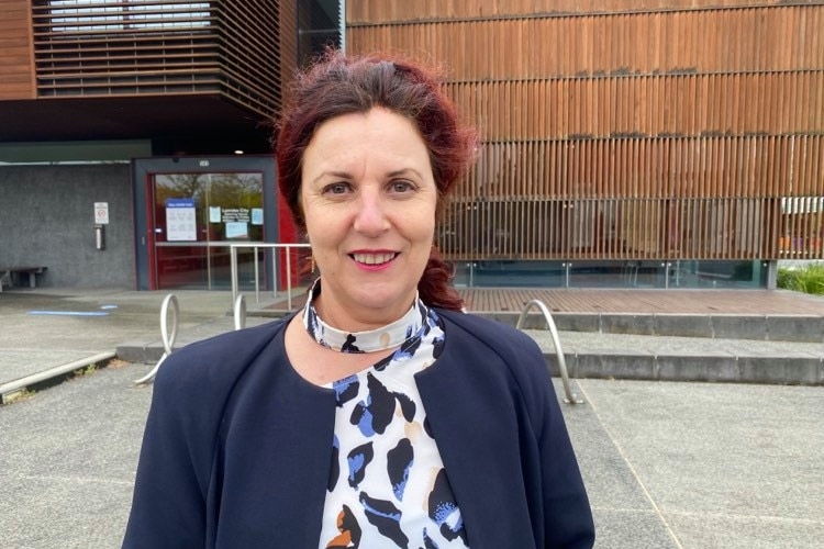 A woman in front of council offices 