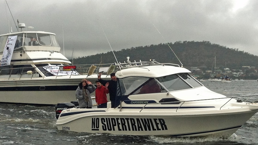 A boat travels down the River Derwent as part of a rally against a super trawler.