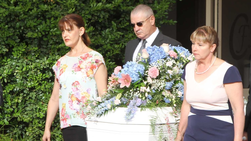 Coffin containing remains of Karlie Pearce-Stevenson and her daughter is transported to their funeral.