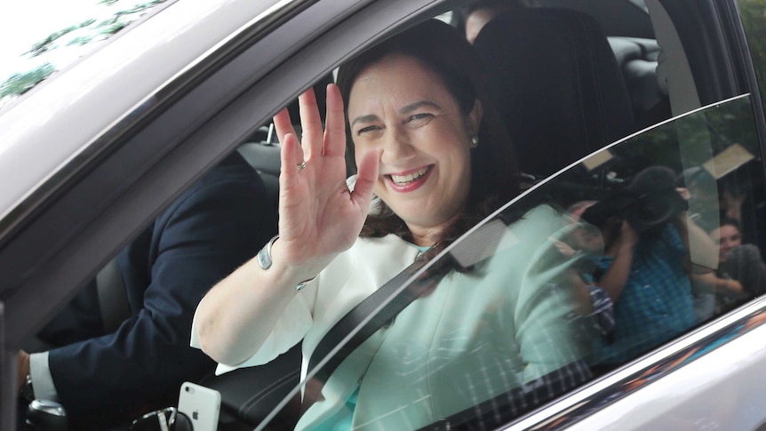 Queensland Premier Annastacia Palaszczuk waves as she arrives to Government House in Brisbane