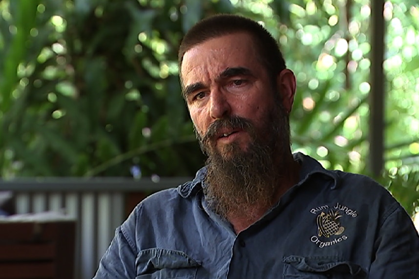 Head shot of Alan Petersen sitting on a porch