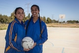 Simran Wadhawan and Jasleen Sandhu of the Sikh Swans netball team