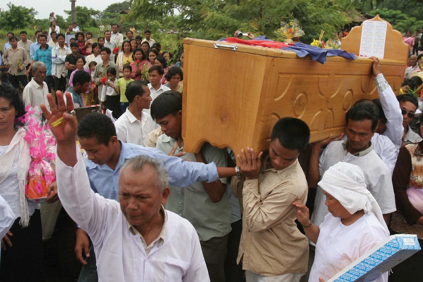 Meas Muth, the alleged Khmer Rouge naval commander leads a funeral procession for Khmer Rouge cadre Ta Mok.