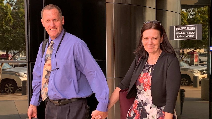 Tracey Brose leaves the District Court at Southport smiling with her husband.