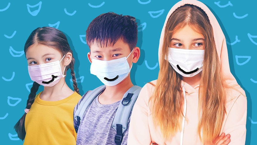 Three kids wearing masks with smiles drawn on them.