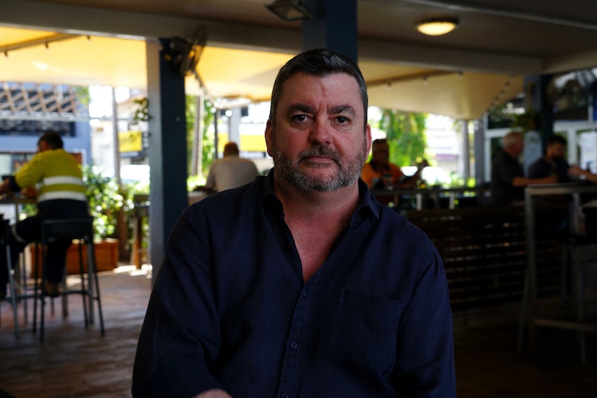 Cavenagh Hotel operator Paul Palmer sits in his pub.