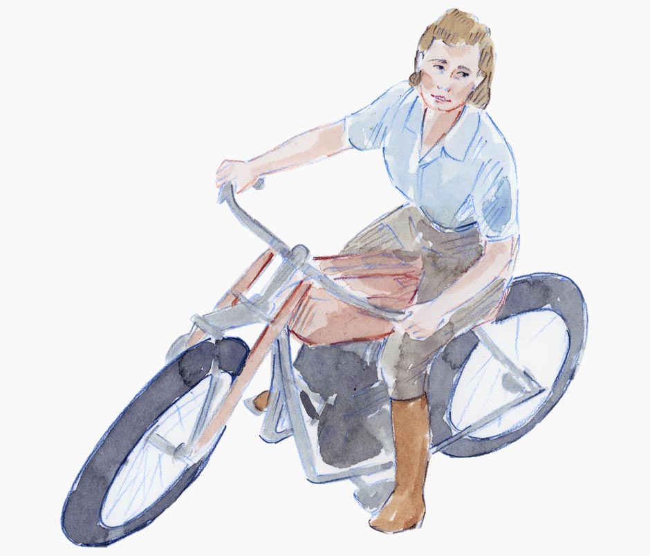 A woman riding an old fashioned chopper motorcyle.
