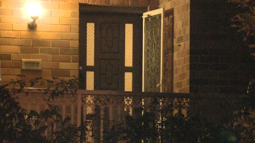 The lit porch of a home in Woolooware