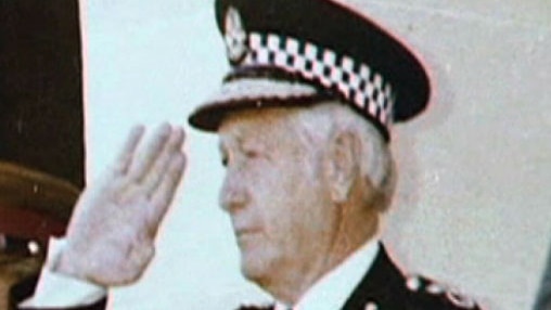 Old photo of former Assistant Commissioner of Police Owen Leitch saluting.