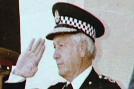 Old photo of former Assistant Commissioner of Police Owen Leitch saluting.