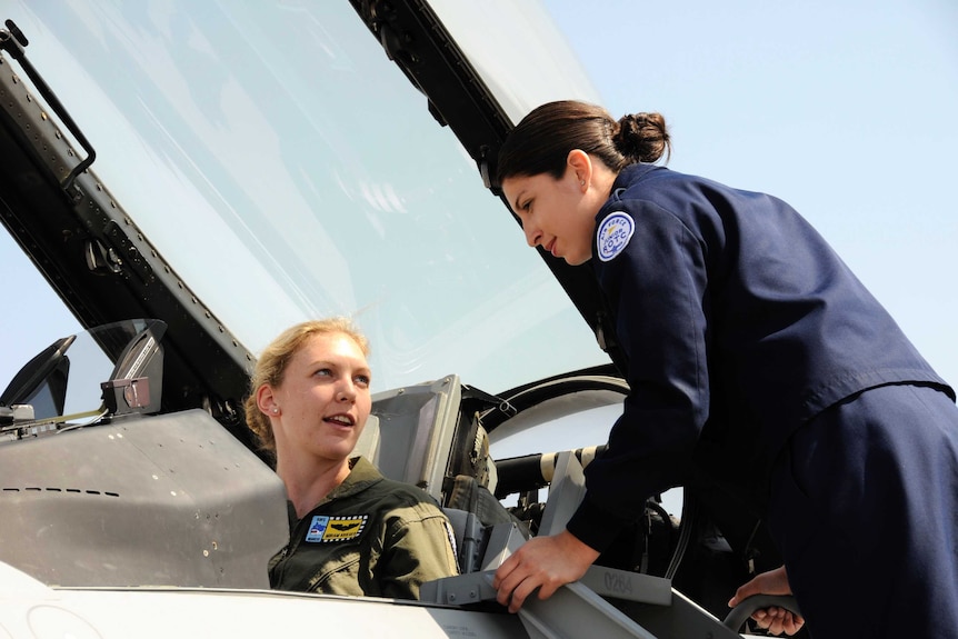 Miriam Krieger in the cockpit of a fighter jet.