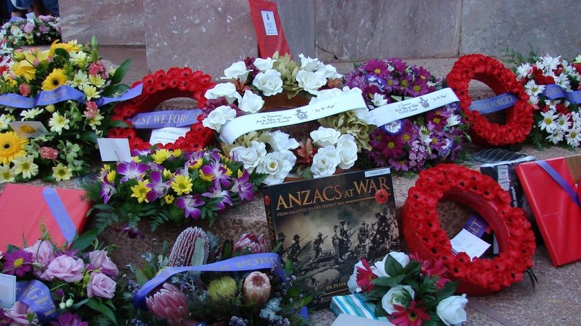 Wreaths lay at Anzac memorial in Townsville.