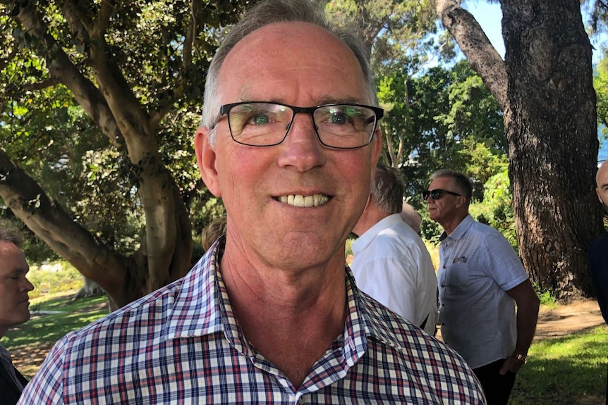 A tight head and shoulders shot of Airbnb host Francis Hourquebie standing outdoors.