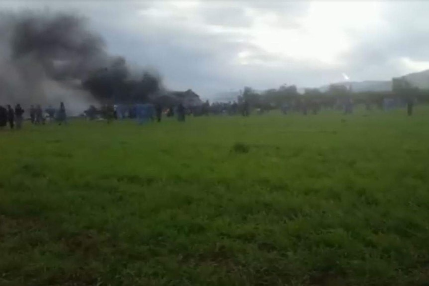Local television showed thick, black smoke billowing from the crash site.