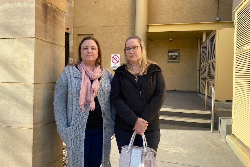 Two women outside South Australia's Coroners Court. 