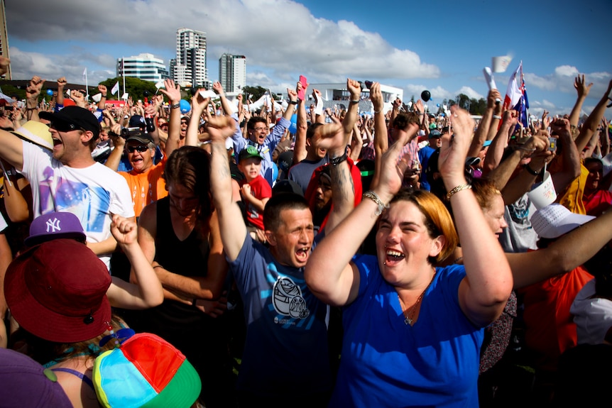People leap in celebration following the announcement of the Gold Coast's winning bid for the 2018 Commonwealth Games