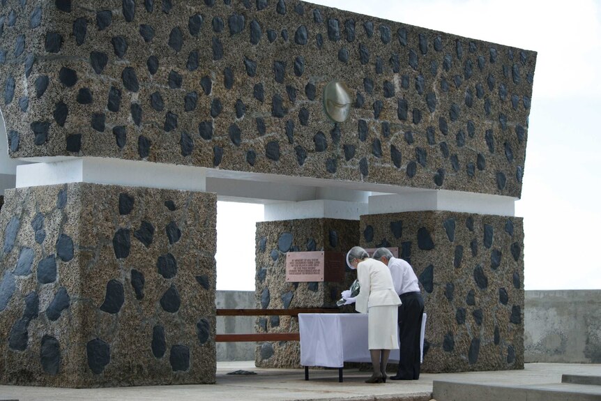 Japanese Emperor Akihito and Empress Michiko lay floral tribute at war memorial in Palau