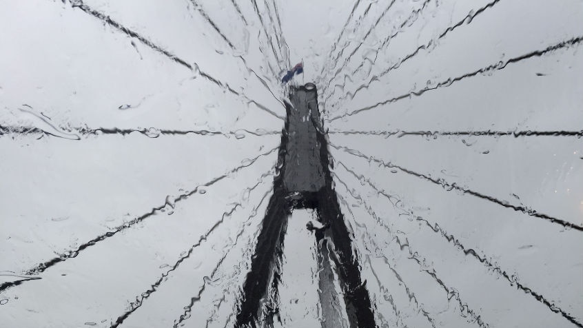 Sydney's Anzac Bridge, seen through a rain-splattered windshield.