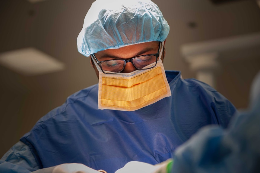 A surgeon from the craniofacial unit in the operating theatre