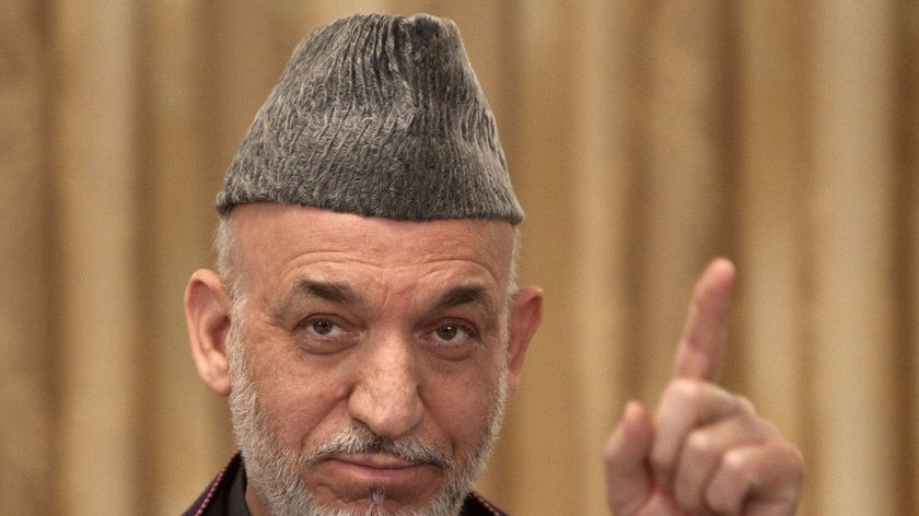 Afghan President Hamid Karzai speaks during a news conference