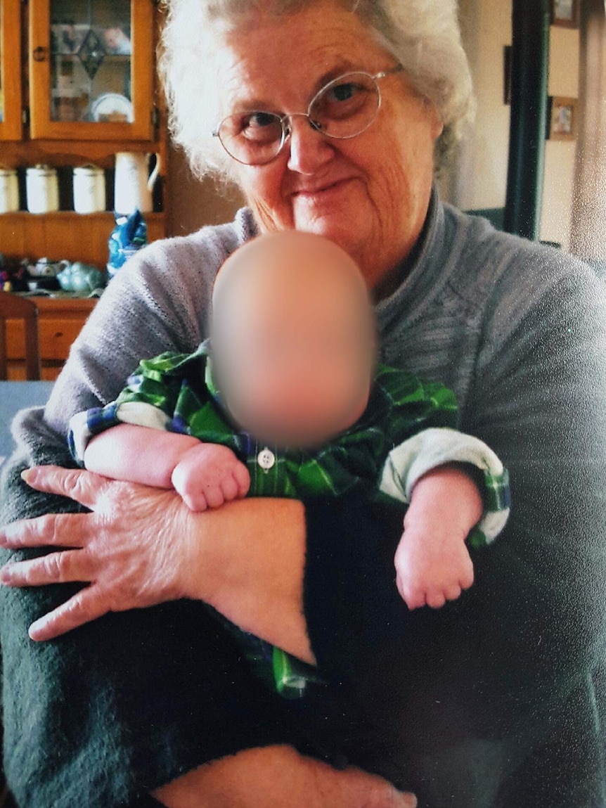 Beverley Quinn sitting with a young child on her lap