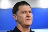 Shane Patton, a man with short dark hair, speaks to media in a Victoria Police uniform.