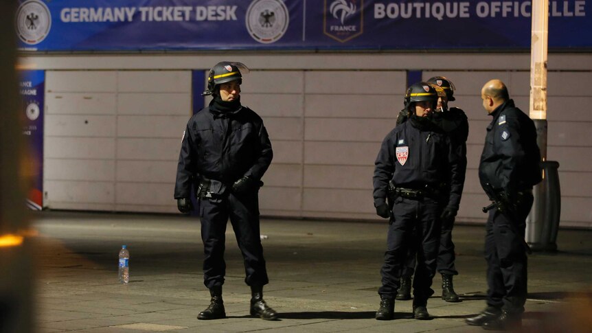 Police stand outside the Stade de France