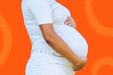 Pregnant woman holding belly for story about maternity leave discrimination