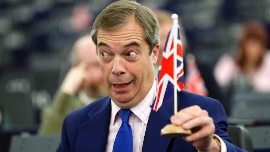 Nigel Farage holding a mini Union Jack flag